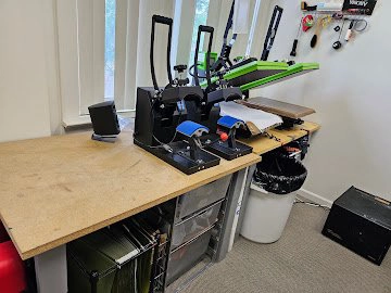 The DTF heat press station at Fan Club Shirts